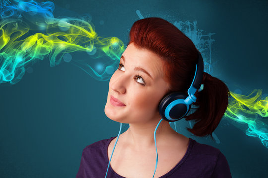 Young woman listening to music with headphones
