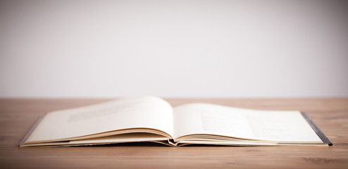 Open book on wooden deck