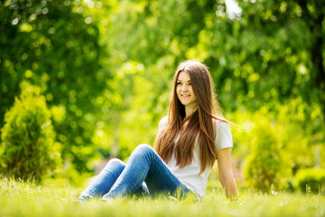 Naklejka na ściany i meble The young woman to spend a relaxing day in nature
