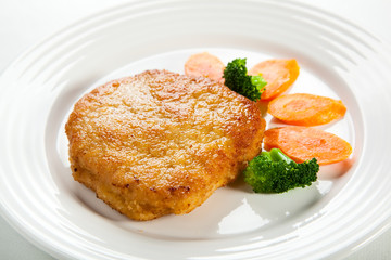 Fried pork chop and vegetables