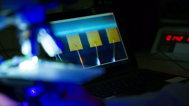 check micro electronic chip under a microscope