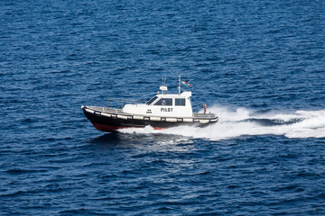 Black and White Pilot Boat on Blue