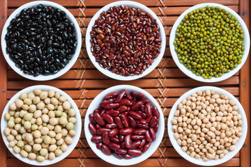 Multicolored beans in ceramics bowl