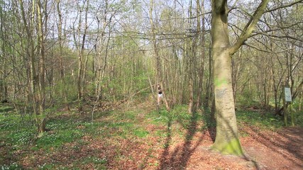 Father and Son running in the forest 