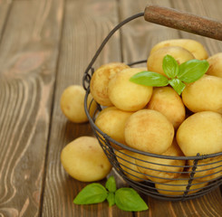 Raw potatoes in a basket