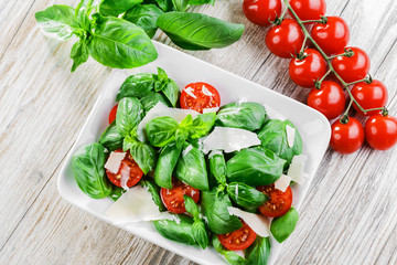 salad with basil and cherry tomatoes  cheese  parmesan