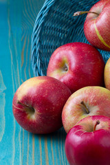 red apples on wooden table
