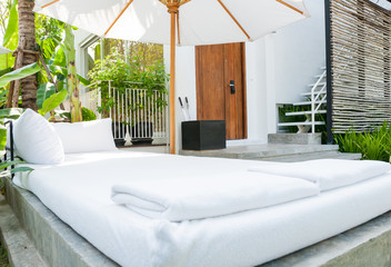 sofa near swimming pool