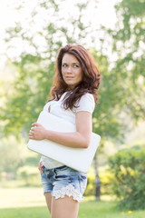 Fototapeta premium Girl with laptop in summer park