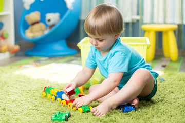 child boy playing with block toys indoor © Oksana Kuzmina