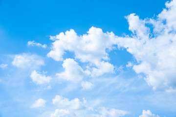 Obraz na płótnie Canvas White fluffy clouds in the blue sky