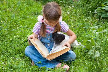 two friends-  little  girl and puppy