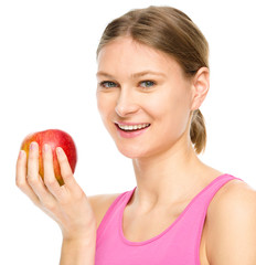 Young happy girl with apple