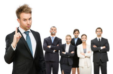 Business people silenced with tape over their mouth 