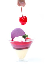 Strawberry shot cake with cherry and macaron