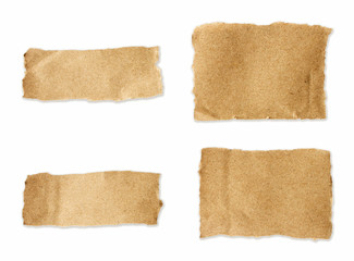 Torn brown paper sheet set on isolated white background