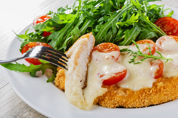 Baked chicken with mozzarella and cherry tomatoes  fillet