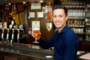 Happy man with glass of beer