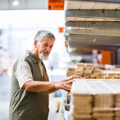 Man buying construction wood in a  DIY store
