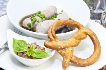 sausages in beer sauce with mustard and pastries