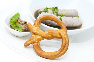 sausages in beer sauce with mustard and pastries