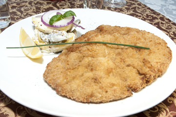 Schnitzel vegetable salad at restaurant