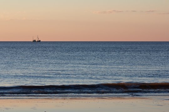 Lonely trawler boat at dusk