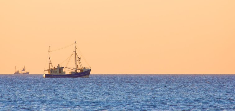 Lonely trawler boats at dusk
