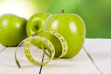 apple with tape measure, concept of healthy eating, lifestyle