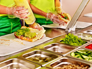 Tray with  food  on showcase at cafeteria