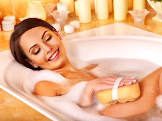 Woman take bubble  bath.