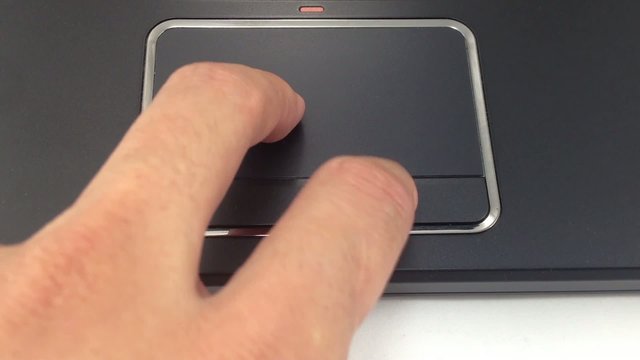 Male hand using laptop touch pad
