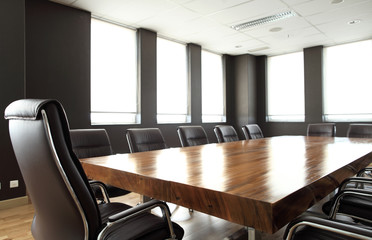 Modern meeting room with solid wood table - 65396910