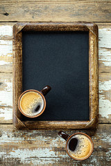 Coffee cups on vintage menu board