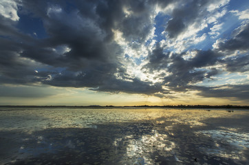 Ominous stormy sky reflection over natural lake