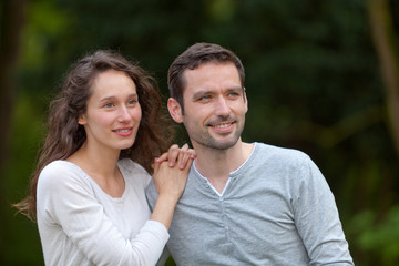 Portrait of a young happy couple in the nature
