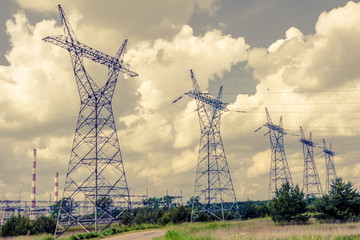 Pylon and transmission power line in sunset
