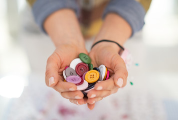 Closeup on seamstress showing buttons