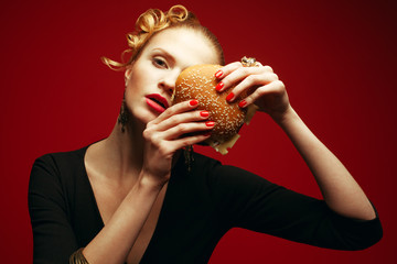 Fahion vs Junk Food Concept. Model with burger