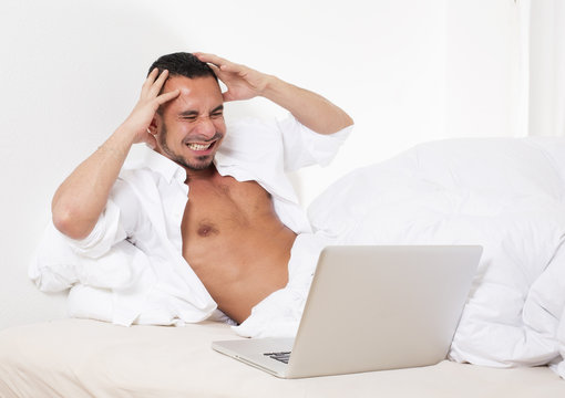 Man In Bed With Laptop