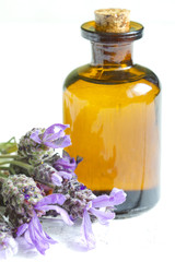 Lavender oil on white planks closeup