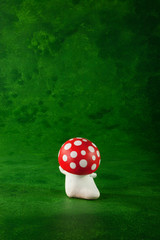 cute puppets handmade, one mushroom, green background