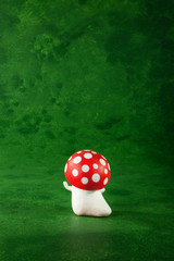 cute puppets handmade, one mushroom, green background