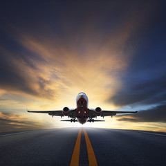 passenger plane take off from runways against beautiful dusky sk - obrazy, fototapety, plakaty
