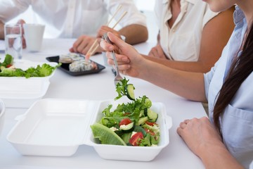 Business people enjoying salad and salad for lunch