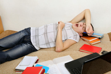 Tired Teenager yawning on Sofa