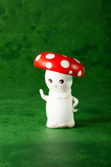 cute puppets handmade, one mushroom, green background