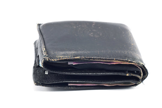 Old black leather wallet isolated on a white background