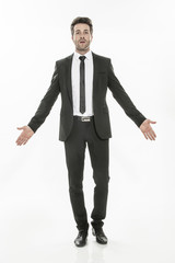 portrait of an expressive young man in suit on isolated backgrou