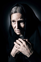 Sad old woman senior in sorrow